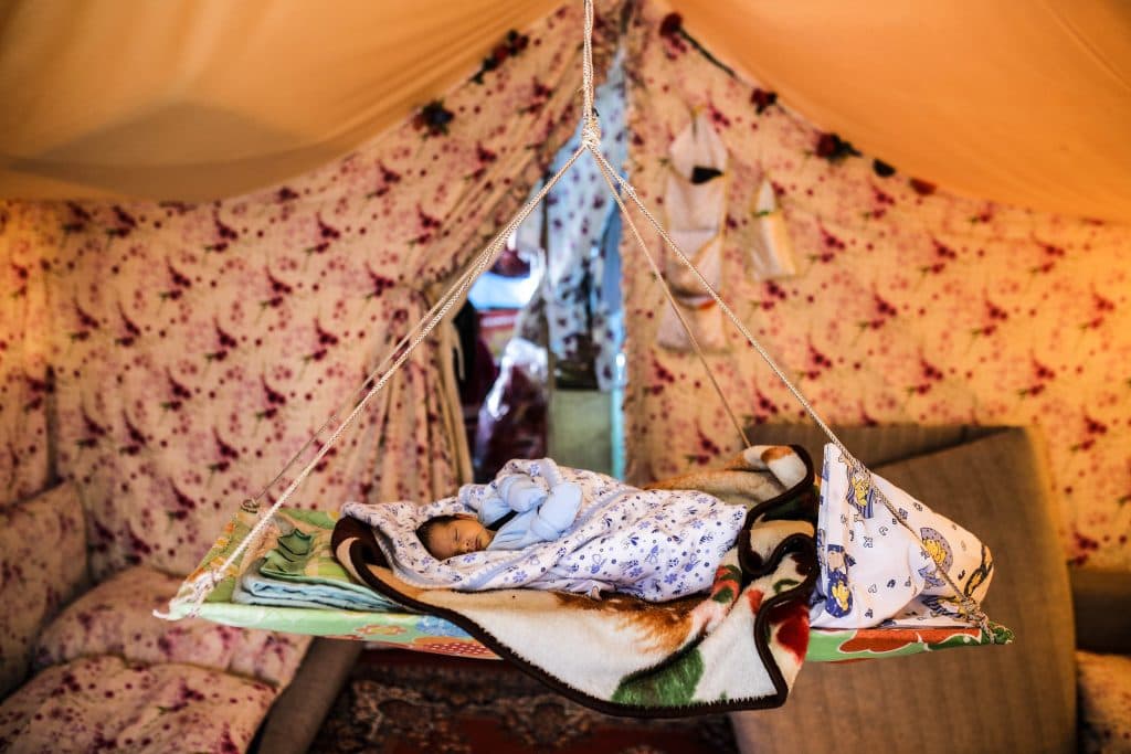 Osmaniye Cevdetiye Camp (Turchia ) 10 febbraio 2016.
Il campo dei rifugiati creato in collaborazione con la Commissione Europea. Un bambino neonato dorme nella culla d'emergenza